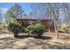 Wide view of the brick home's back exterior with deck and natural landscape at 3080 Forrest Park Road Se, Atlanta, GA 30354