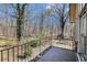 Balcony features black iron railing with wooded view at 3080 Forrest Park Road Se, Atlanta, GA 30354