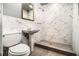 A well-appointed bathroom with a shower, modern fixtures, and a pedestal sink at 3080 Forrest Park Road Se, Atlanta, GA 30354