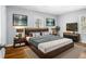 Well staged bedroom features neutral colors, modern furnishings and decor, and natural lighting at 3080 Forrest Park Road Se, Atlanta, GA 30354