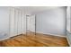 Bright bedroom featuring hardwood floors, spacious closet, and neutral paint at 3080 Forrest Park Road Se, Atlanta, GA 30354