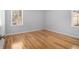 Bedroom with hardwood floors, base trim, neutral paint, and natural light from the windows at 3080 Forrest Park Road Se, Atlanta, GA 30354