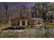 Charming brick home with black shutters and mature trees, creating a cozy and inviting curb appeal at 3080 Forrest Park Road Se, Atlanta, GA 30354