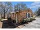 Well-maintained brick home with updated landscaping and charming architectural details at 3080 Forrest Park Road Se, Atlanta, GA 30354