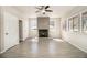Spacious and well-lit living room featuring tiled floors and a cozy fireplace at 3080 Forrest Park Road Se, Atlanta, GA 30354