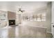 Spacious living room with a decorative fireplace, tiled floors, and plenty of natural light at 3080 Forrest Park Road Se, Atlanta, GA 30354