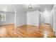 Spacious living room featuring gleaming hardwood floors and neutral paint, perfect for relaxing and entertaining guests at 3080 Forrest Park Road Se, Atlanta, GA 30354
