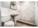 Bathroom showcases a sleek vanity, toilet, and tiled walk-in shower with modern fixtures at 3080 Forrest Park Se Rd, Atlanta, GA 30354