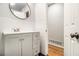 Bathroom features a modern vanity with storage, a stylish mirror, and tile accents at 3080 Forrest Park Se Rd, Atlanta, GA 30354
