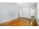 This bedroom showcases hardwood floors, closet, neutral paint, and easy access to the bathroom at 3080 Forrest Park Se Rd, Atlanta, GA 30354
