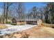 Inviting home with a long driveway, brick facade, and manicured front yard at 3080 Forrest Park Se Rd, Atlanta, GA 30354