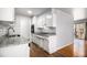 Bright kitchen features white cabinets, granite countertops, and stainless steel appliances at 3080 Forrest Park Se Rd, Atlanta, GA 30354