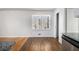 Open-concept room combines kitchen and dining area with warm wood floors and natural light at 3080 Forrest Park Se Rd, Atlanta, GA 30354