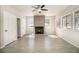 Large living area showcases a fireplace, multiple windows, and neutral tiled flooring at 3080 Forrest Park Se Rd, Atlanta, GA 30354