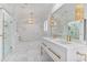 Elegant bathroom features double vanity, marble tile, and glass enclosed shower at 80 26Th Nw St, Atlanta, GA 30309