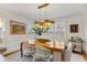 Dining room featuring a stylish chandelier, a large table with seating, and ample natural light at 80 26Th Nw St, Atlanta, GA 30309