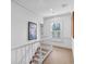Upstairs hallway with natural light, crown molding, and carpeted steps at 80 26Th Nw St, Atlanta, GA 30309