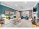 Comfortable living room with a fireplace, built-in bookshelves, and stylish decor at 80 26Th Nw St, Atlanta, GA 30309