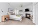 Cozy main bedroom with fireplace, ceiling fan, and a neutral color palette at 80 26Th Nw St, Atlanta, GA 30309