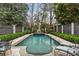 Beautiful swimming pool enclosed by lush landscaping and privacy fences, creating a private and tranquil outdoor space at 80 26Th Nw St, Atlanta, GA 30309