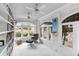 Bright sunroom with tile floors, many windows, and built-in bookshelves, creating a serene retreat at 80 26Th Nw St, Atlanta, GA 30309