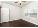 Bedroom with hardwood floors, ceiling fan, and a large window at 830 Corsiglia Farm, Marietta, GA 30060