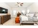 Bright bedroom features a ceiling fan, neutral walls and stylish furnishings at 830 Corsiglia Farm, Marietta, GA 30060