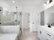 Bathroom featuring a glass shower enclosure, double sink vanity, and a soaking tub at 1356 Auburn Glen Rd, Dacula, GA 30019