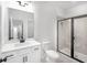 Contemporary bathroom with tiled walk-in shower, single vanity, and modern fixtures at 1356 Auburn Glen Rd, Dacula, GA 30019