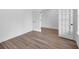 Room featuring wooden flooring and doors with glass panels at 1356 Auburn Glen Rd, Dacula, GA 30019
