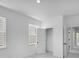 Bright bedroom featuring neutral walls, two windows, and a closet at 1356 Auburn Glen Rd, Dacula, GA 30019