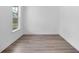 A room with wood flooring and a large window at 1356 Auburn Glen Rd, Dacula, GA 30019