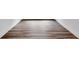 Close-up of modern hardwood flooring with clean white baseboards at 1356 Auburn Glen Rd, Dacula, GA 30019