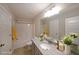 Bathroom featuring a single sink vanity with granite countertop, tub/shower combo, and neutral color scheme at 207 Tan Yard Rd, Social Circle, GA 30025