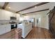 Modern kitchen featuring stainless steel appliances, butcher block island, and open layout at 207 Tan Yard Rd, Social Circle, GA 30025