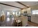 Modern kitchen and dining area with hardwood floors and ample lighting at 207 Tan Yard Rd, Social Circle, GA 30025