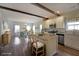 Bright, open kitchen with stainless appliances, butcher block island and seamless flow into dining room at 207 Tan Yard Rd, Social Circle, GA 30025