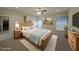 Comfortable main bedroom with a large bed, natural light, and a walk-in closet at 207 Tan Yard Rd, Social Circle, GA 30025