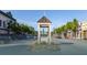 View of the picturesque town square, with flowering shrubs and street parking at 207 Tan Yard Rd, Social Circle, GA 30025