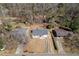 Aerial view of homes with long driveways, mature trees, and spacious yards in a peaceful neighborhood at 4558 Ryan Rd, Conley, GA 30288
