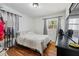 Cozy bedroom with hardwood floors, natural light, and closet at 4558 Ryan Rd, Conley, GA 30288