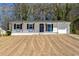 Beautifully renovated ranch-style home with a well-maintained front yard and an attached garage at 4558 Ryan Rd, Conley, GA 30288