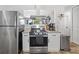 Kitchen features stainless appliances, granite counters, and white cabinets at 4558 Ryan Rd, Conley, GA 30288