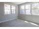Bright bedroom with large windows offering views of the backyard and natural light at 2628 Songbird Ln, Grayson, GA 30017