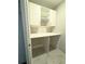 Walk-in closet with custom shelving, storage, and a built-in desk area at 2628 Songbird Ln, Grayson, GA 30017