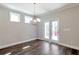 Cozy dining area featuring contemporary lighting fixture and doors leading to outdoor space at 2628 Songbird Ln, Grayson, GA 30017