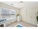 Bright bedroom featuring neutral carpet and a closet with double doors, offering a serene and versatile space at 2845 Hickory Cir, Snellville, GA 30078