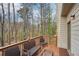 Enjoy the outdoors on this inviting deck with seating, offering serene views of the surrounding trees at 2845 Hickory Cir, Snellville, GA 30078