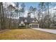 Charming single-Gathering home with an attached garage, long driveway, and beautifully maintained lawn at 2845 Hickory Cir, Snellville, GA 30078