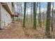 Exterior view of the home, surrounded by tall trees at 2845 Hickory Cir, Snellville, GA 30078